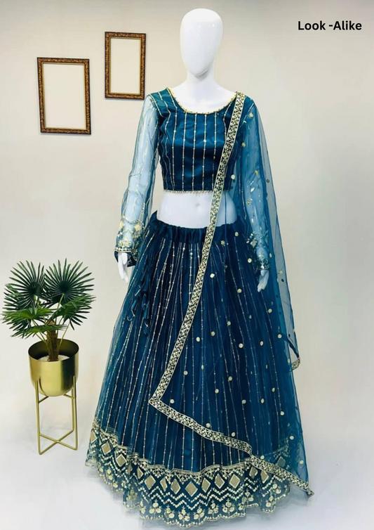Attractive Teal Blue Color Net Embroidered Lehenga Choli For Women