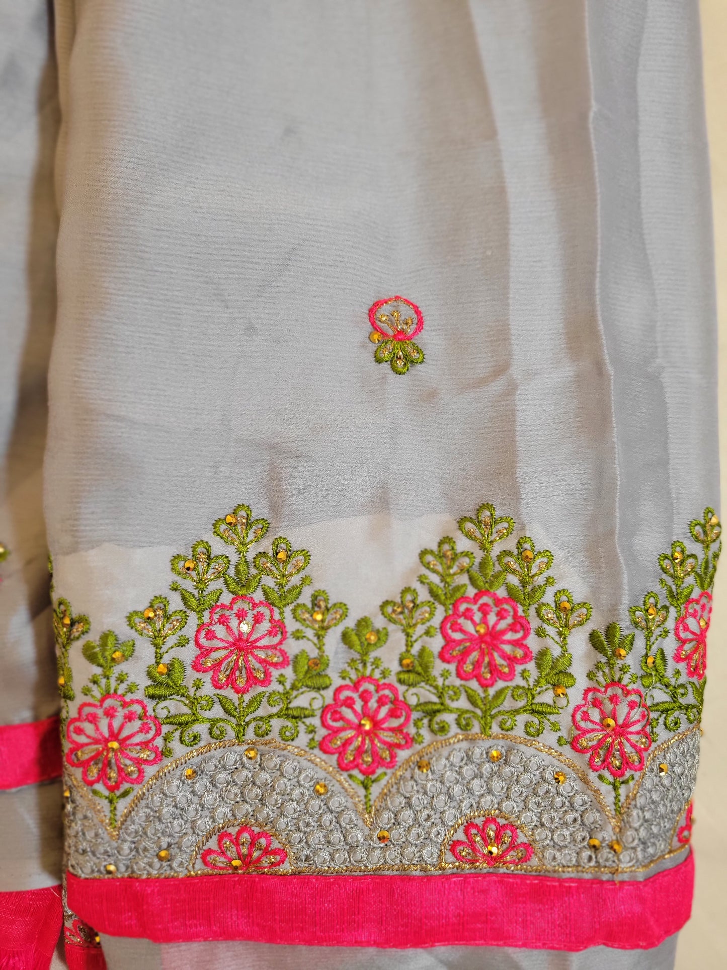 Gray Color Embroidery Georgette Saree With Contrast Pink Lace Border In Suncity