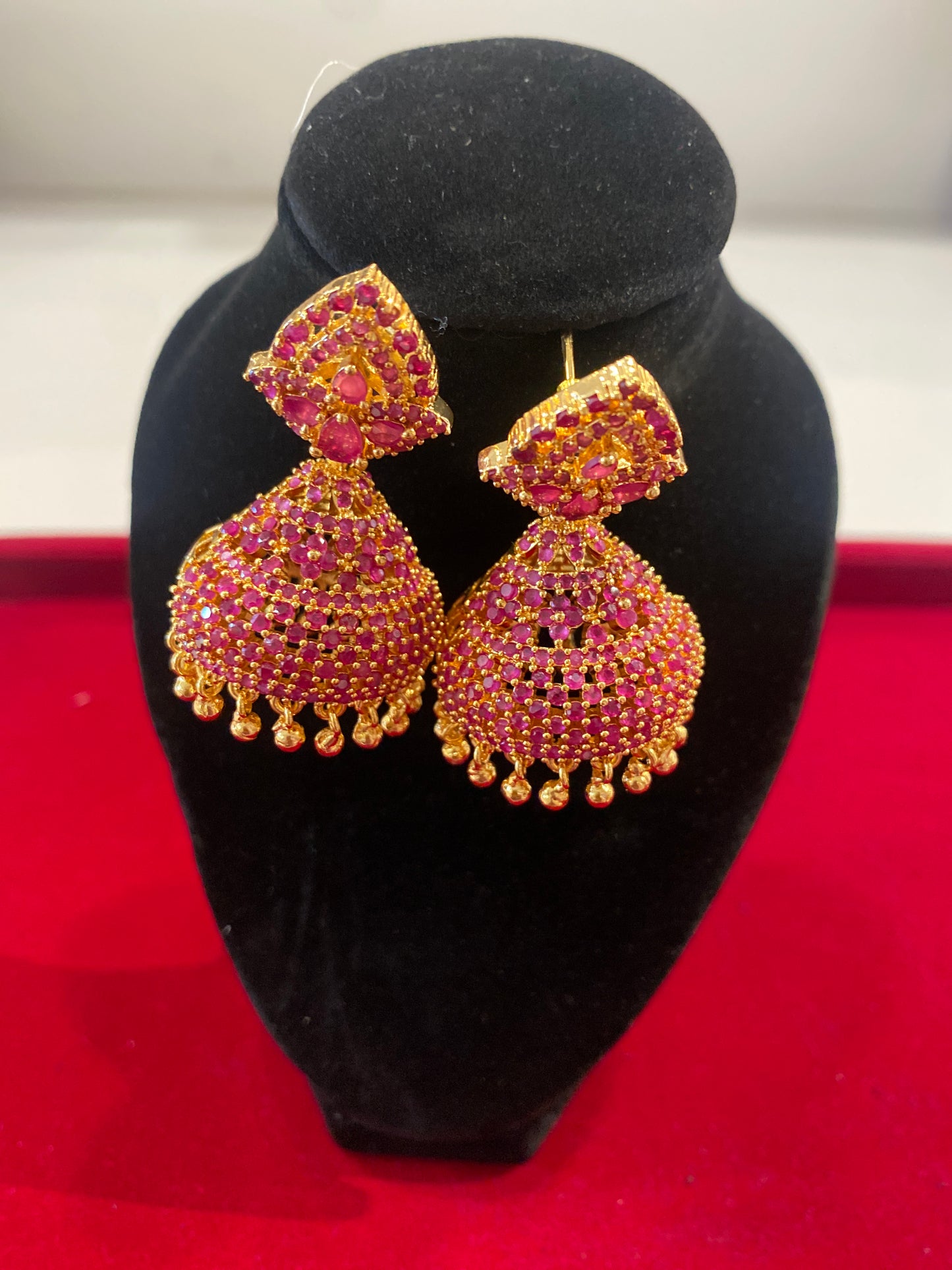 Gorgeous Red Stones Embadded Gold Plated Jhumkas For Women