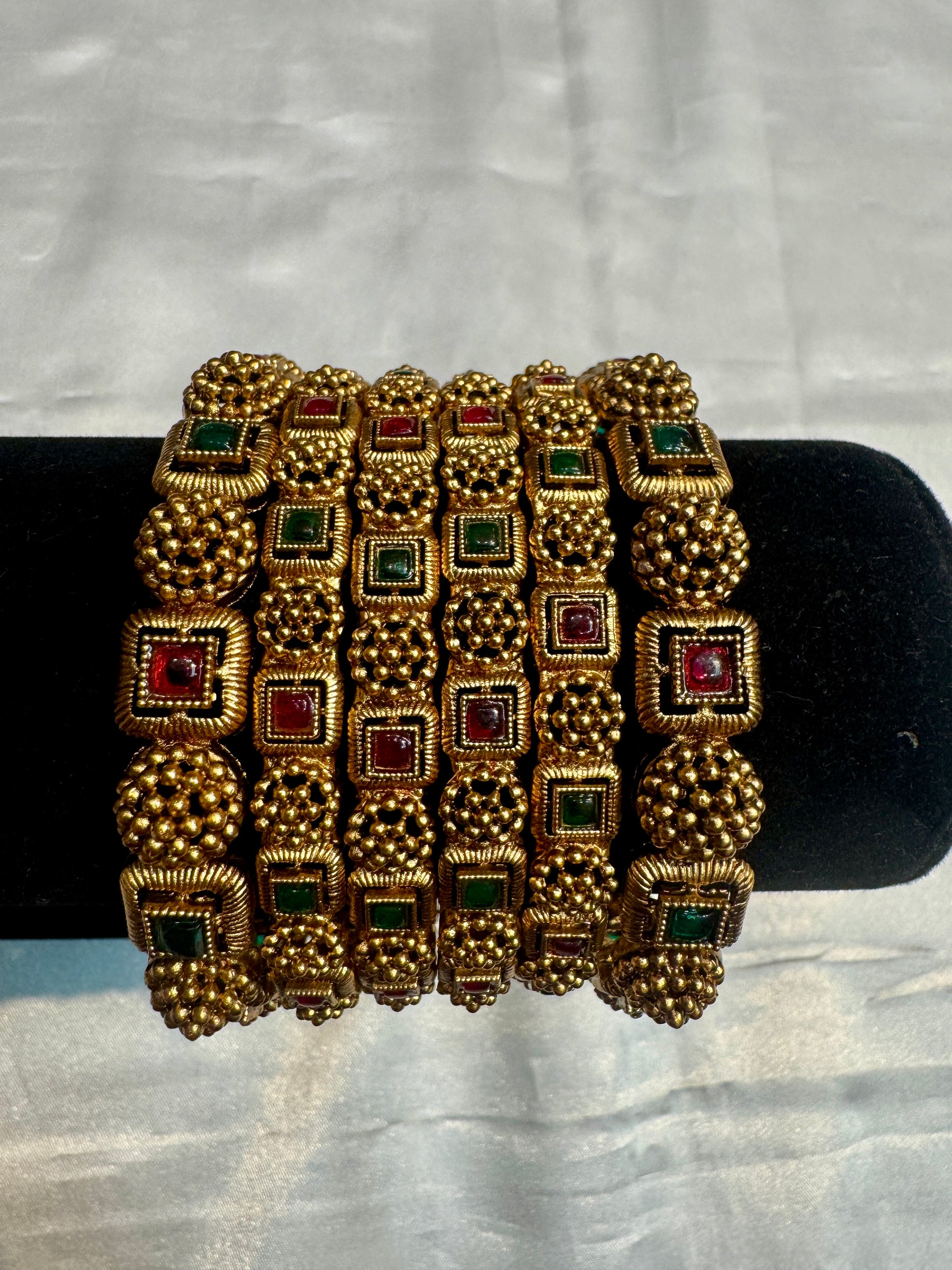 Alluring Antique Gold With Red And Green Stones Studded Bangles For Women
