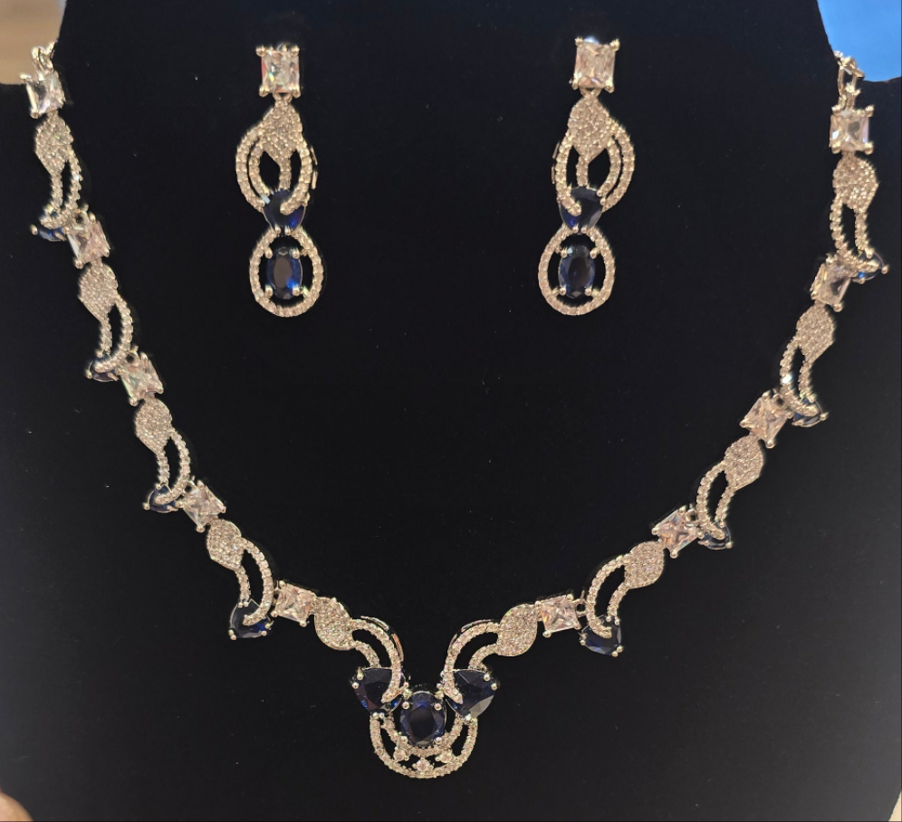 Ravishing Blue Stone Embedded American Diamond Necklace With Pretty Earrings Set