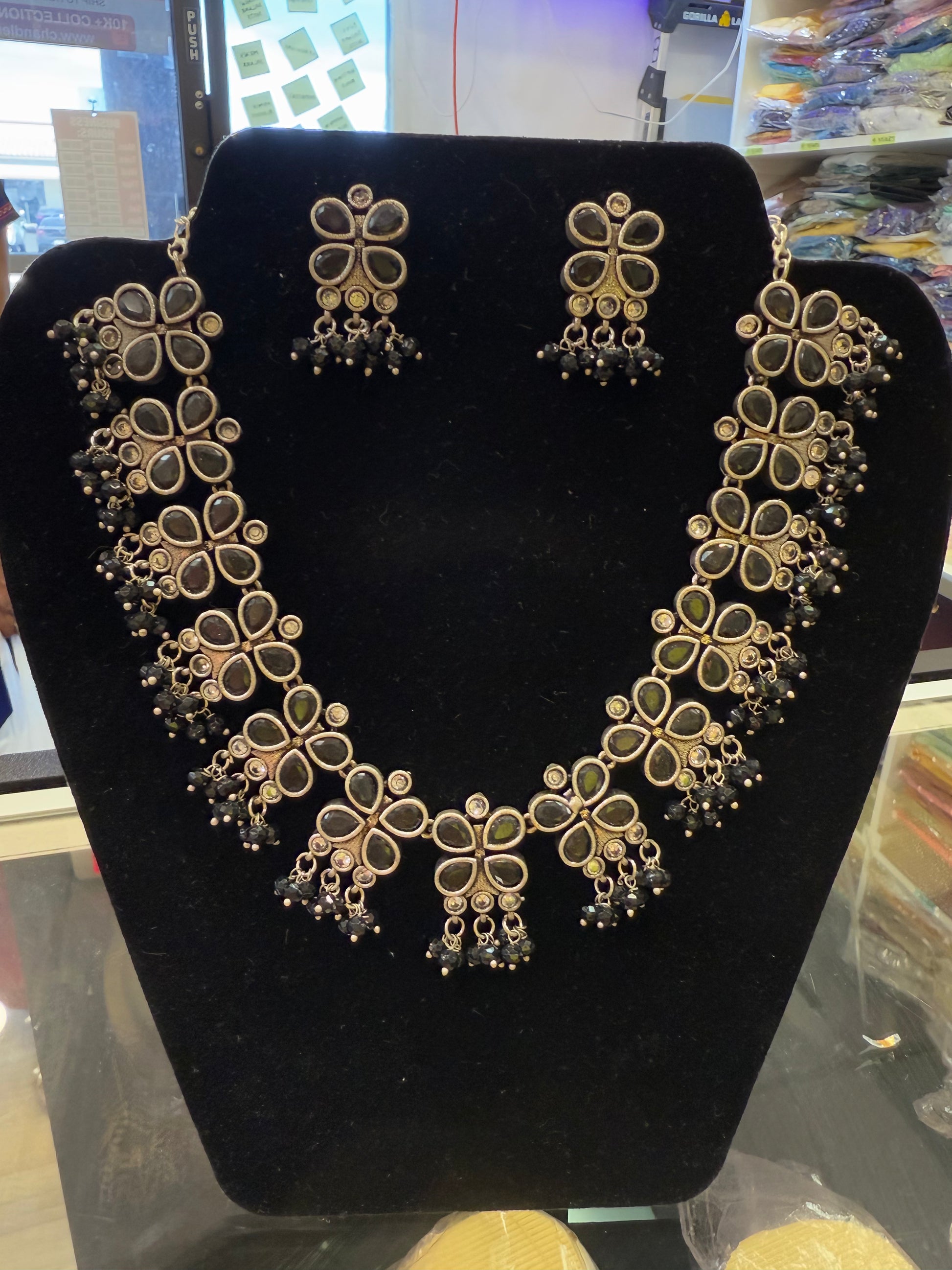 Alluring Black Stone Flower Design Silver Toned Oxidized Necklace Set With Earrings