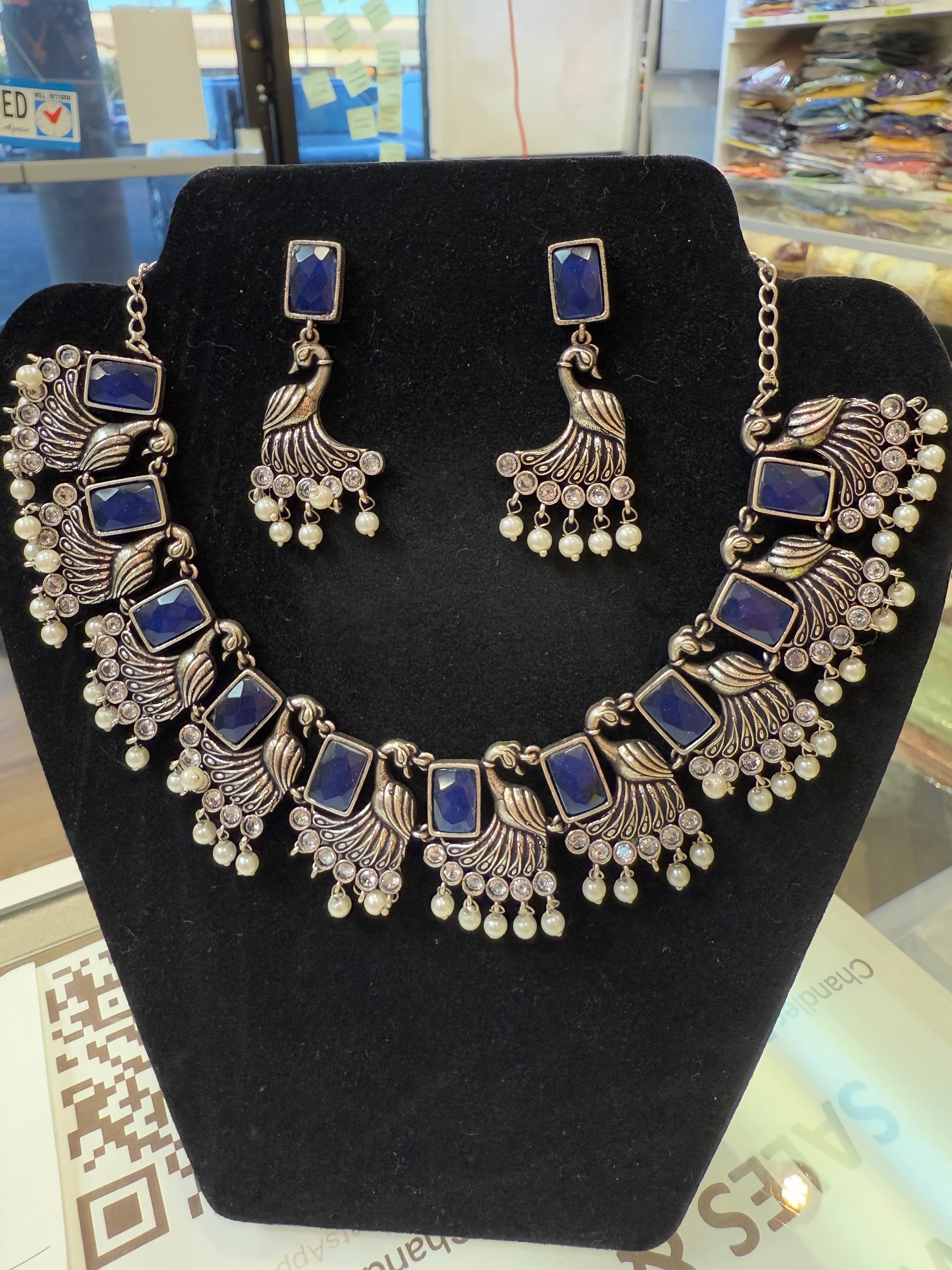 Amazing Blue Stone Studded German Silver Plated Peacock Design Oxidized Necklace Set With Earrings And Pearl Beads