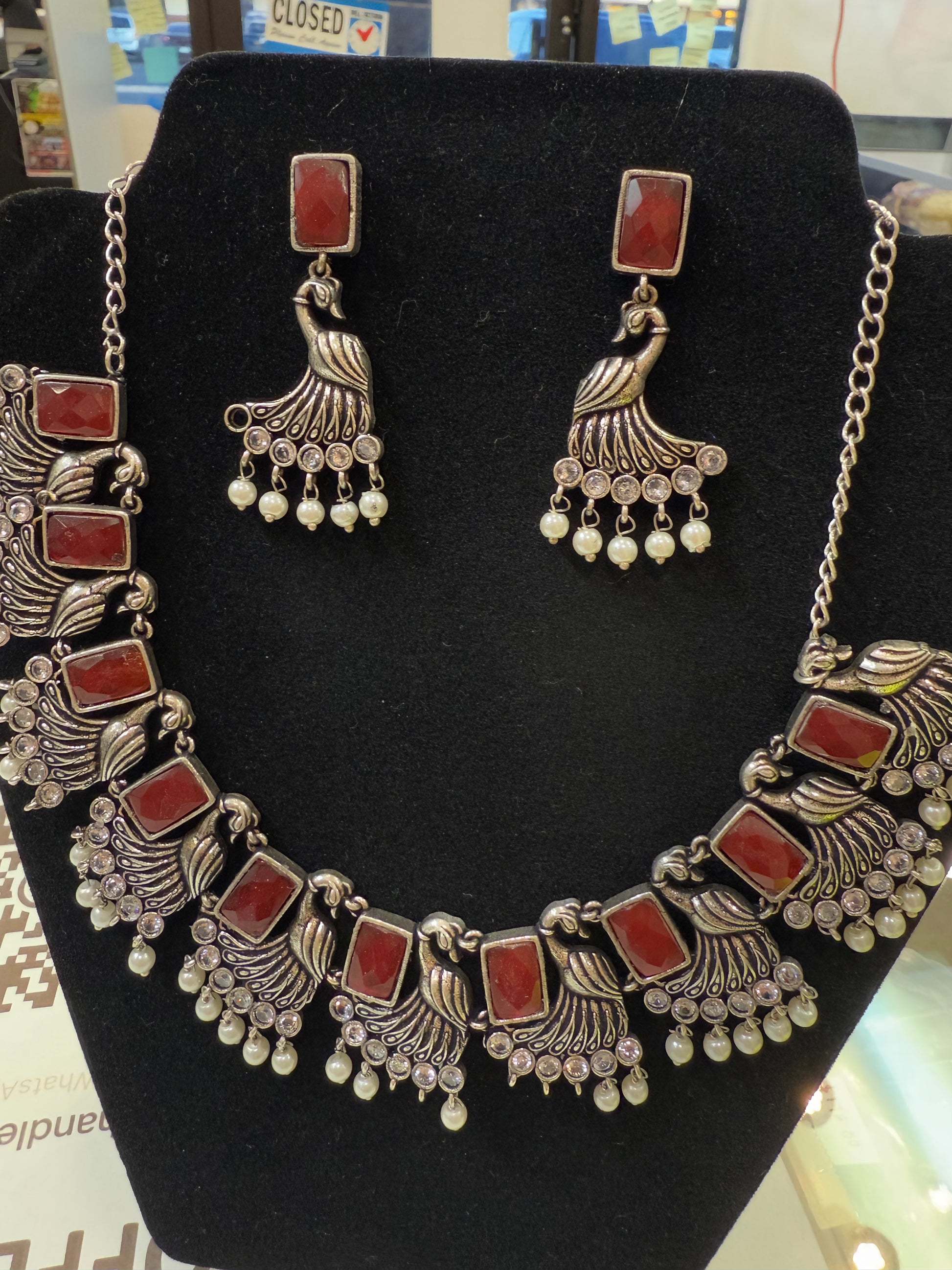 Amazing Maroon Stone Studded German Silver Plated Peacock Design Oxidized Necklace Set With Earrings And Pearl Beads