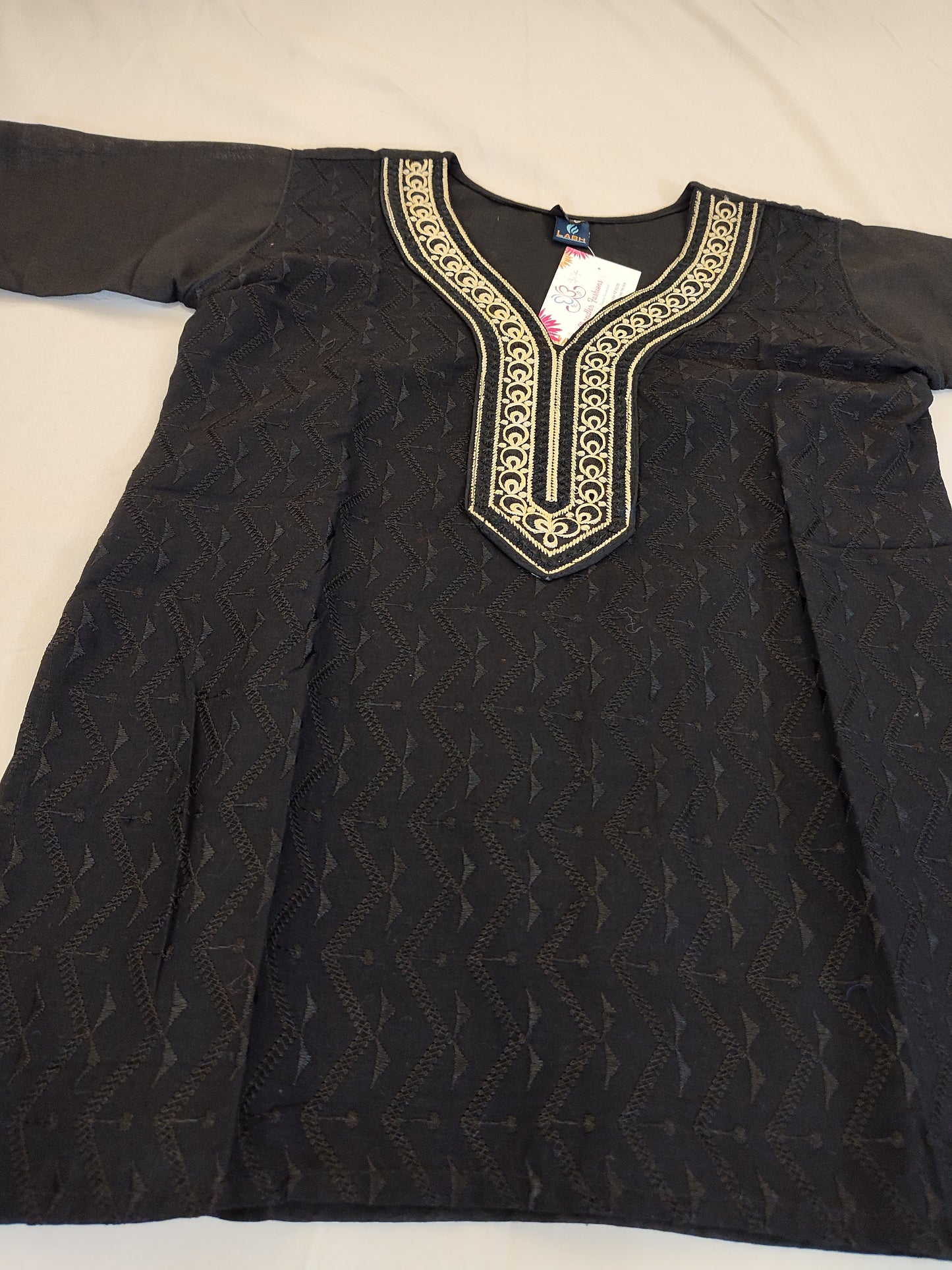 Attractive Black Color Short Top With Embroidery Work In Yuma