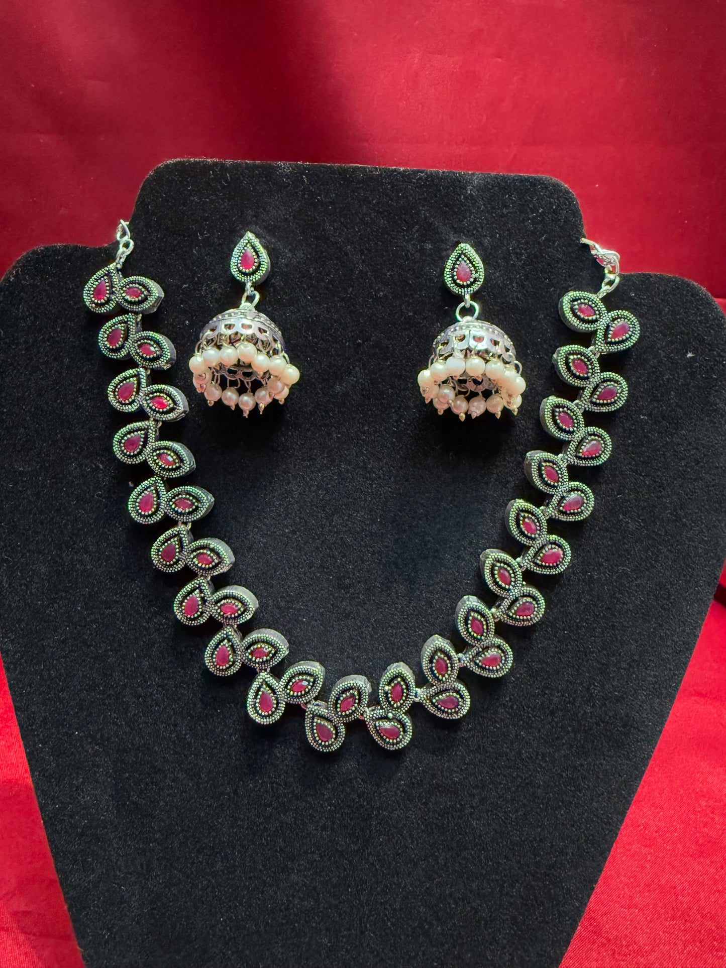 Appealing Red Stoned Oxidized With Pearl Beaded Necklace With Jhumka Set