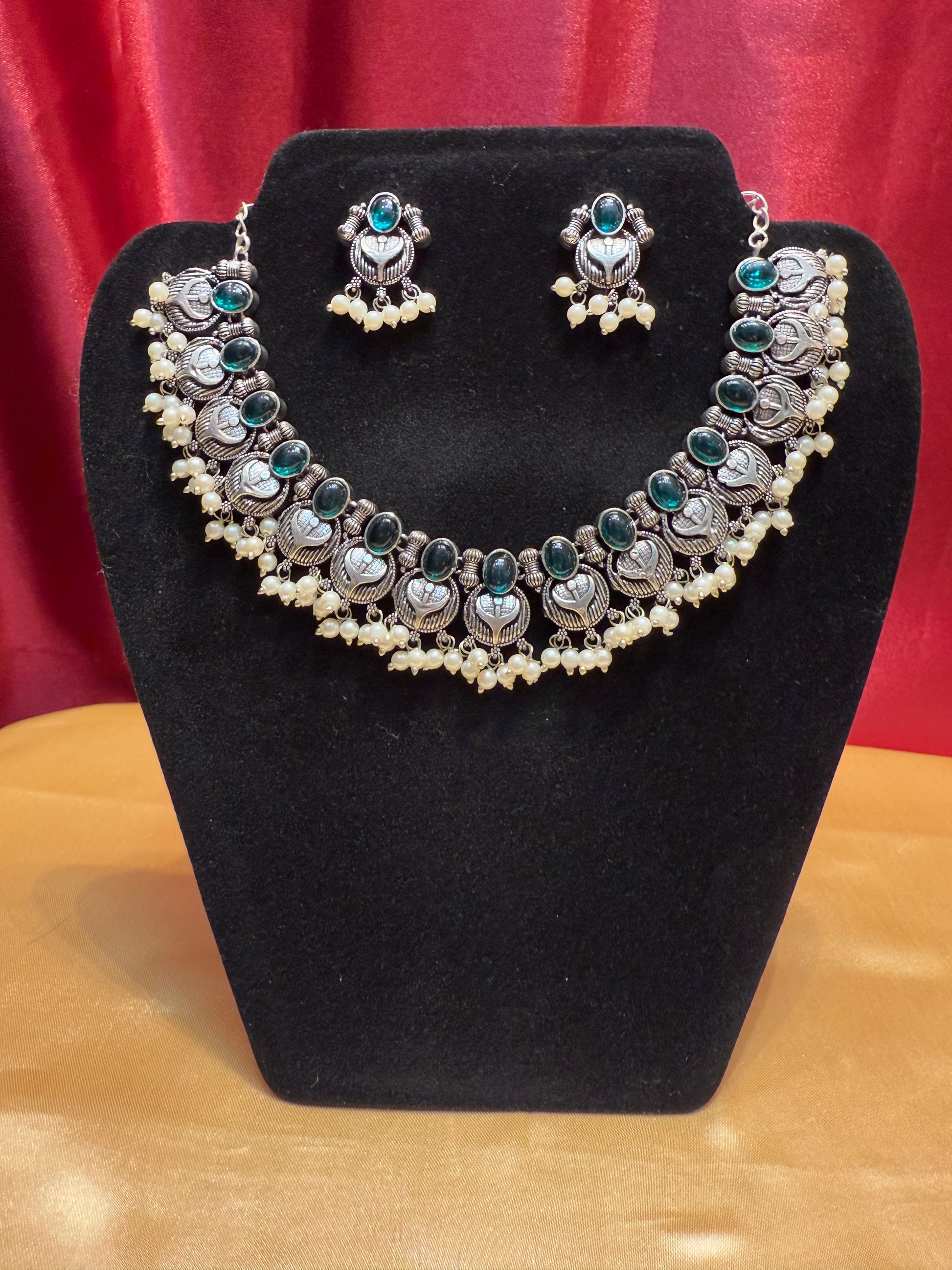 Appealing Emerald Green Stoned Oxidized Pearl Beaded Necklace With Earring Set