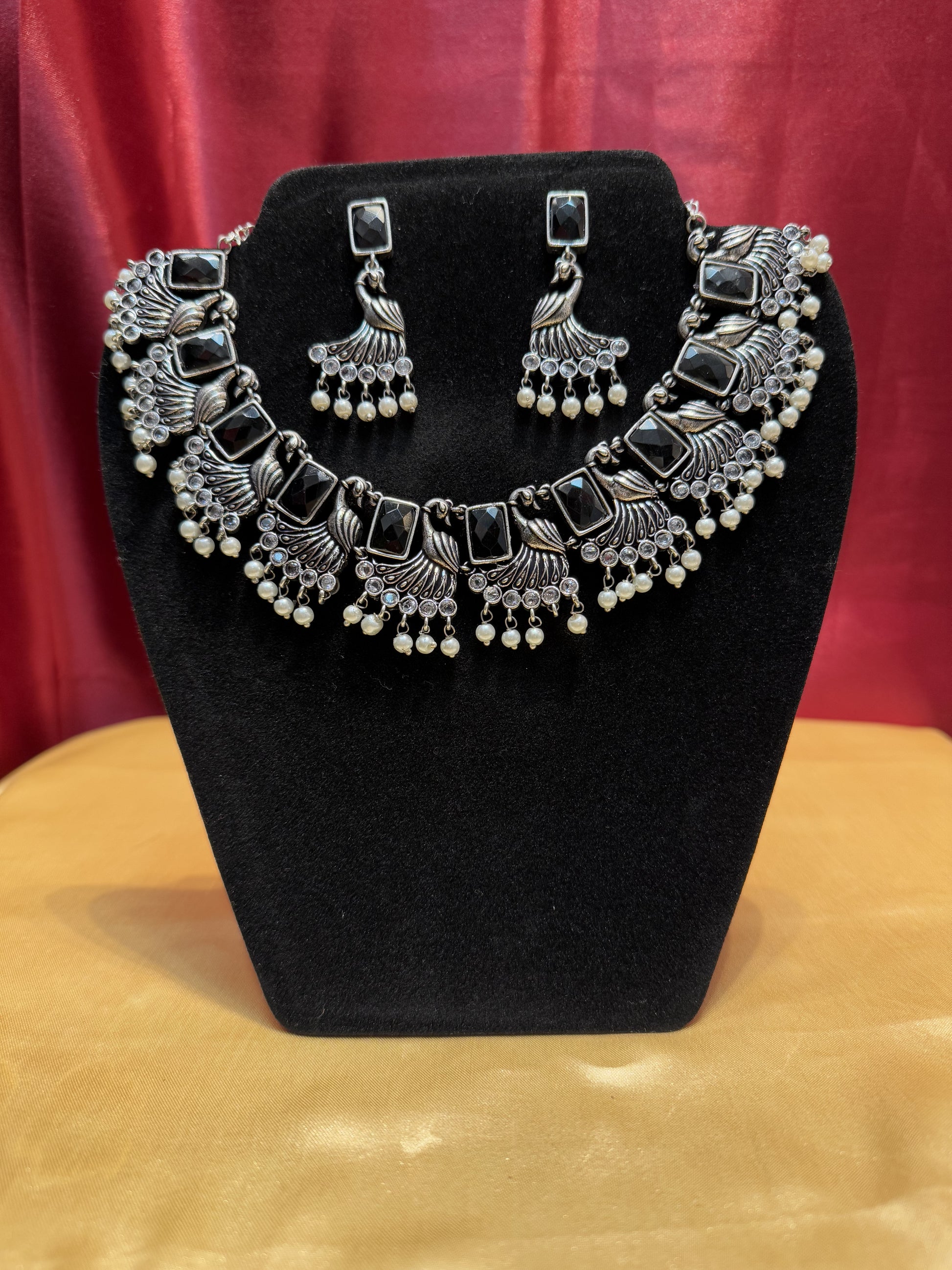 Black Color Peacock Designed Necklace With Earring Set In Yuma