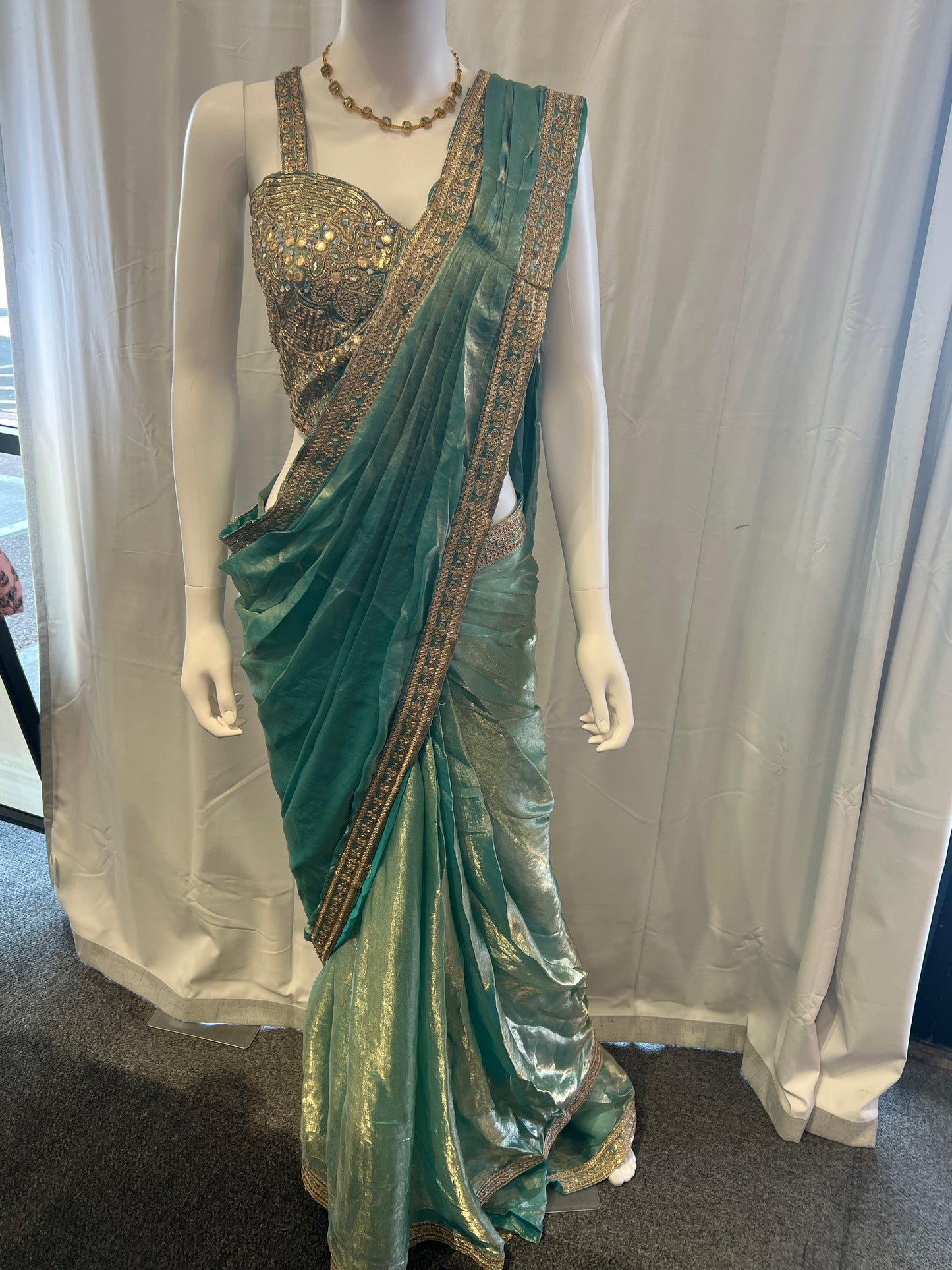 Attractive Teal Blue Color Tissue Silk Lehenga Choli With Embroidery And Sequins Work For Women