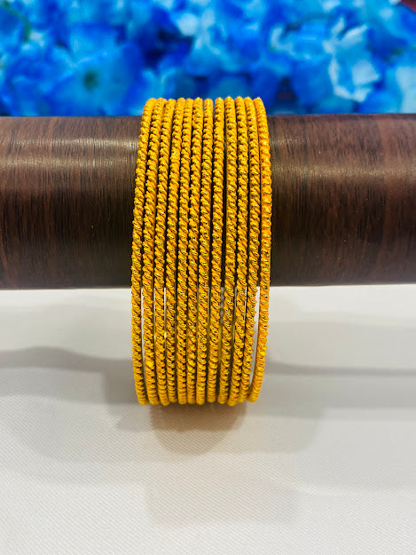 Fascinating Yellow Color Antique Gold Bangles With Plain Running Dots