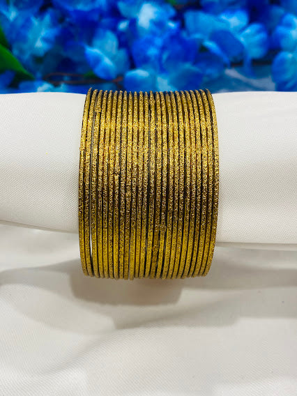 Alluring Glittery Gold Plated Designer Party Style Thin Metal Bangle Sets
