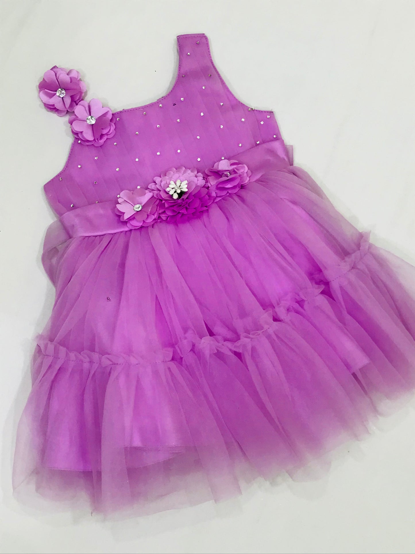 Pretty Purple Colored Kids Party Wear Net Frock In C handler