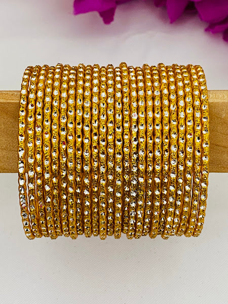 Stunning Designer Yellow Color Metal Bangle Set With Glitters