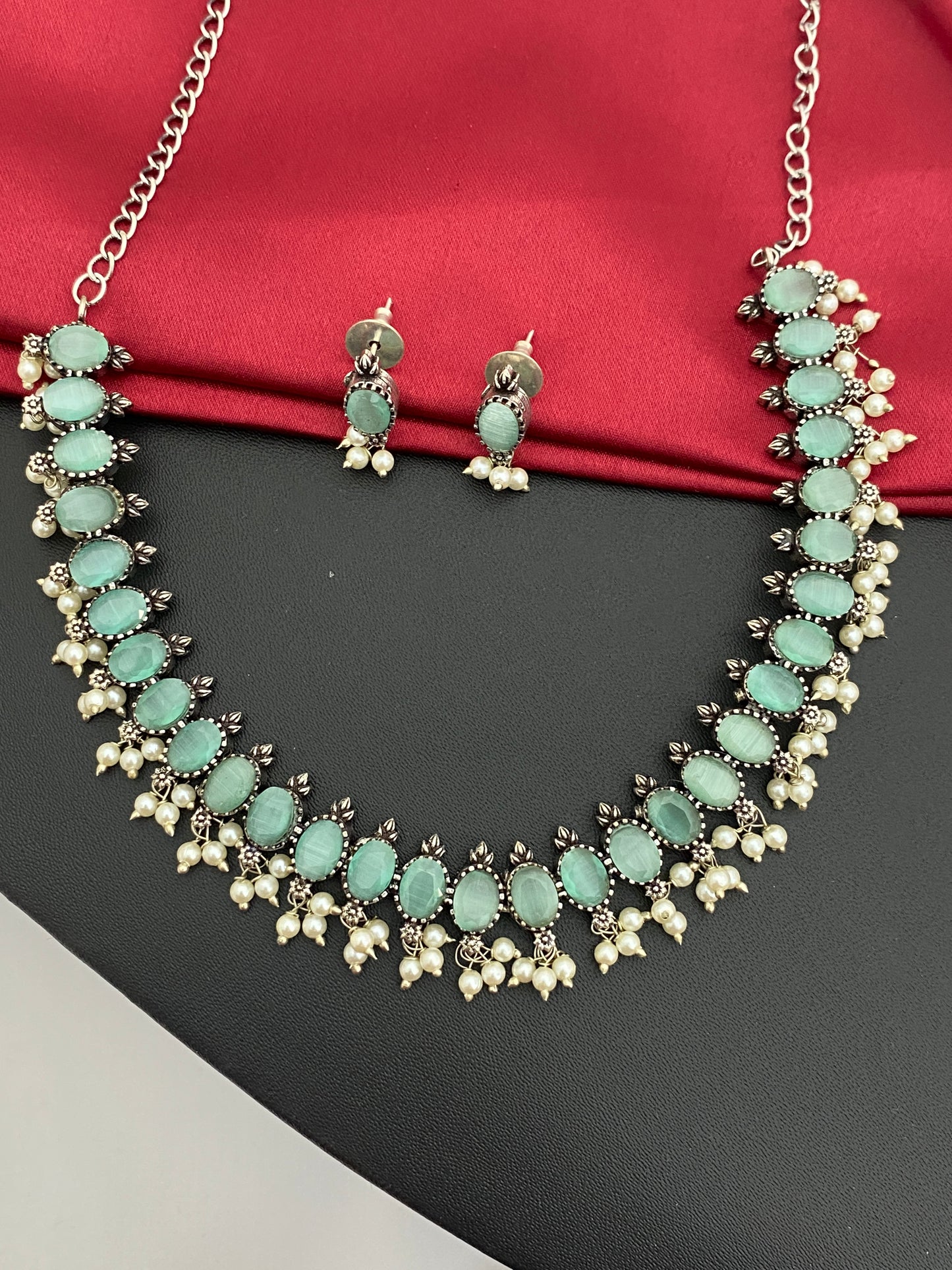 Appealing Pastel Green Stone Studded Oxidized Necklace Set With Earrings