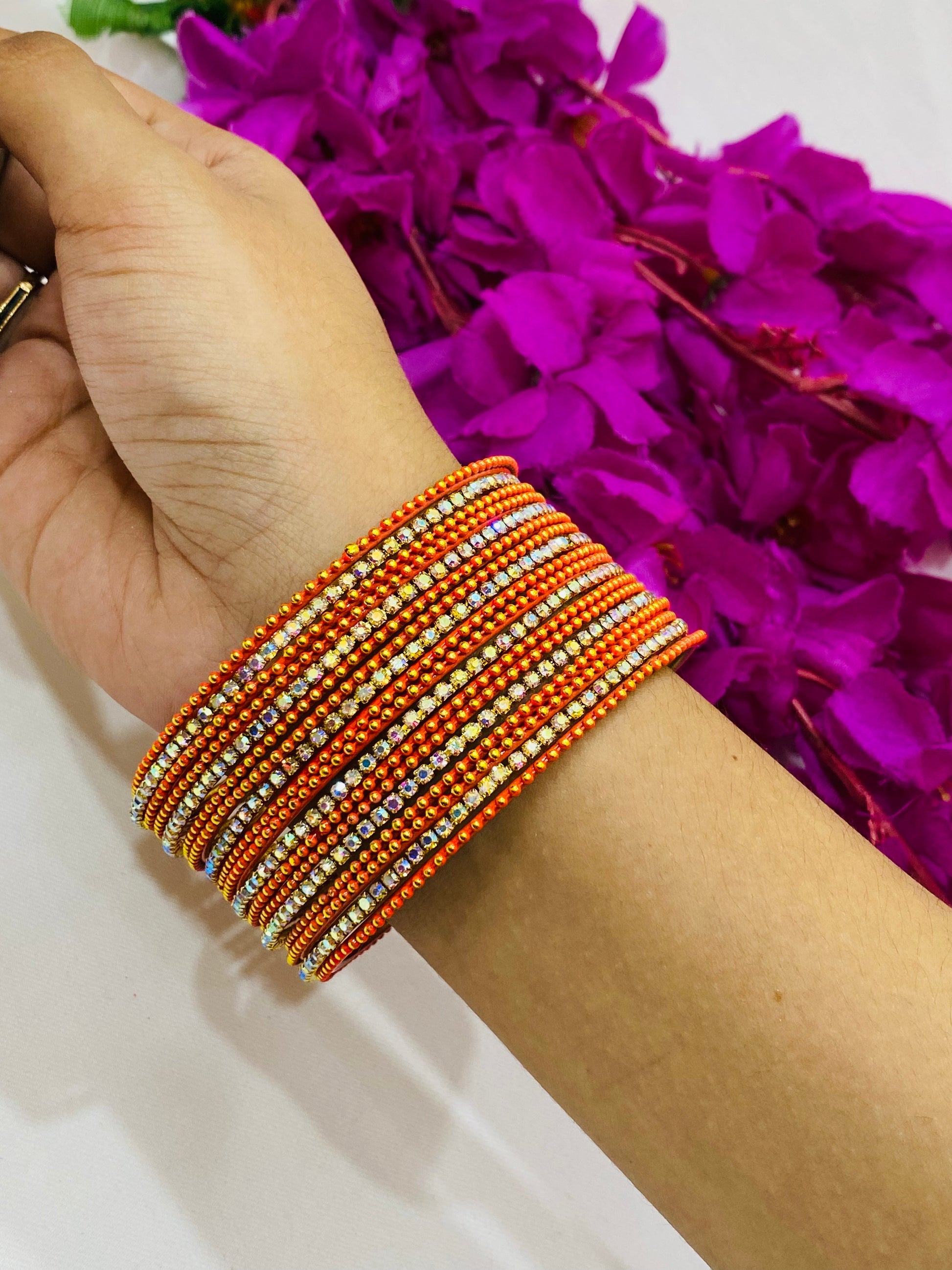 Alluring Orange Color Bangles With Flashing White Stone In Suncity