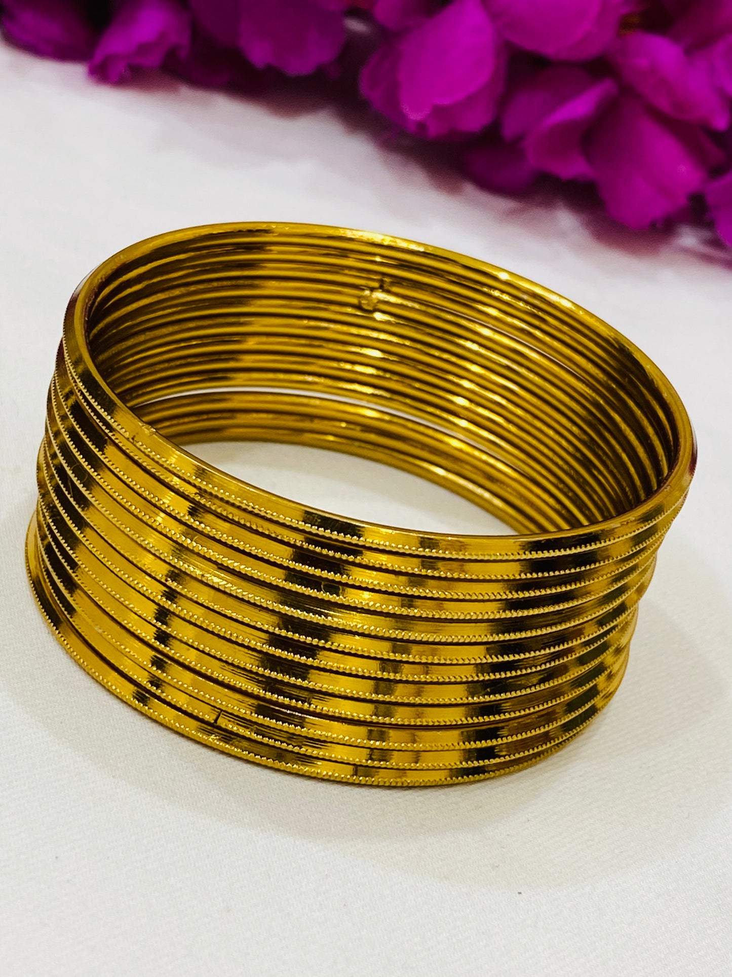 Elegant Gold Colored Metal Bangles In Tempe