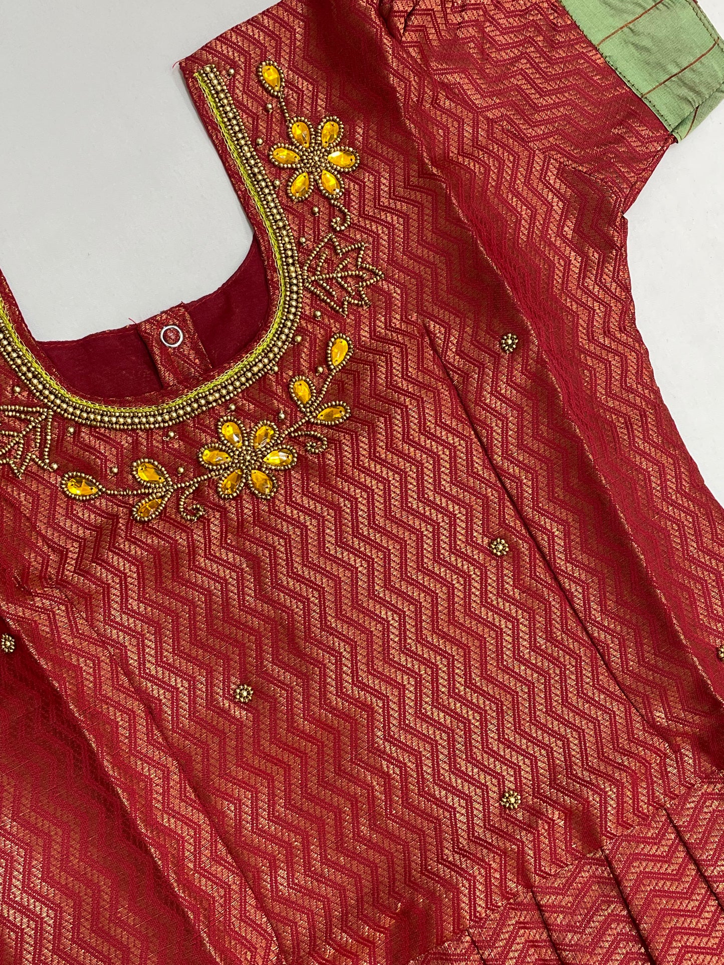 Maroon And Green Color Silk Langa sets With Zari Work In Suncity