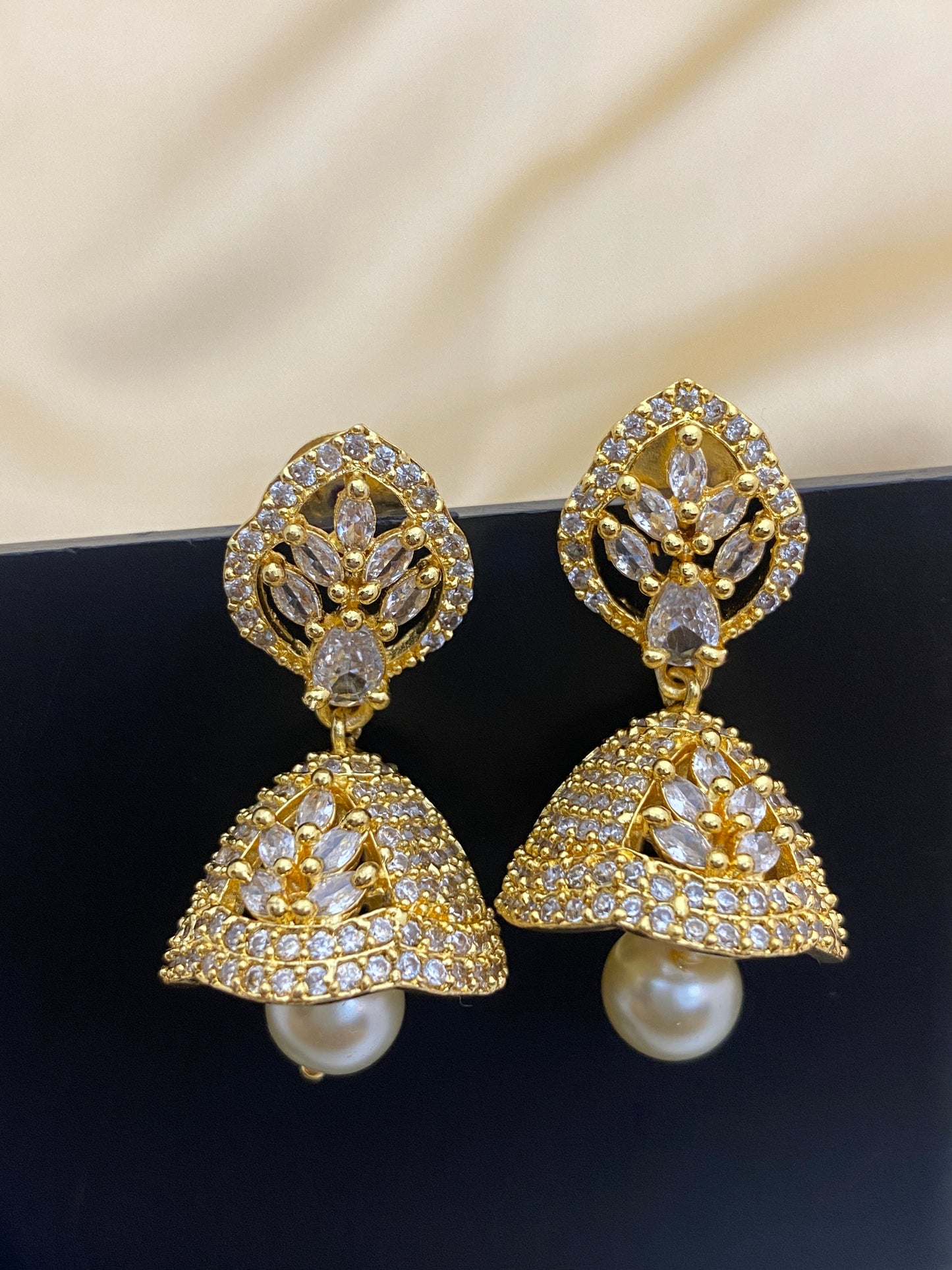 Gold Plated White Color Jhumka Earrings With CZ Stones In Tucson