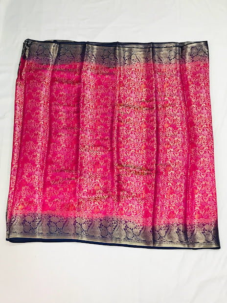 Exclusive Pink Color Banarasi Soft Silk Peacock Motif Saree With Contrast Blue Border