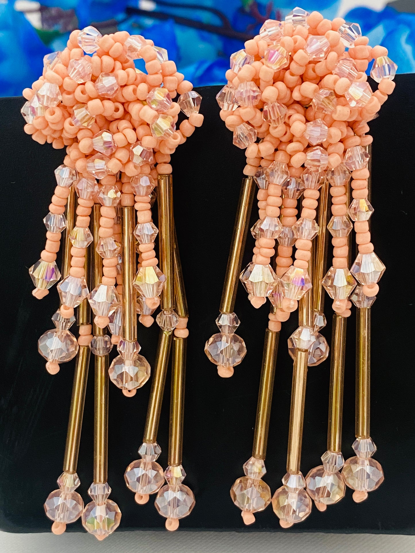 Alluring Peach Colored Hanging Fancy Crystal Earrings