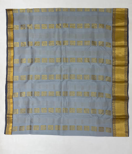 Gray Color Pure Kanchi Silk With Gold Zari Work And Blue Pallu Saree In Suncity