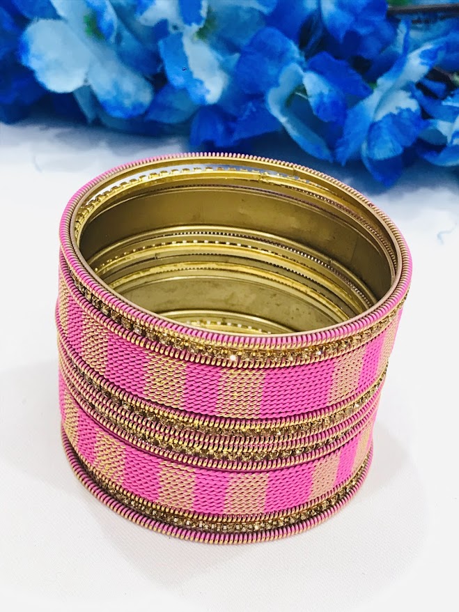 Appealing Twisted Spiral Designed Pink Color Metal Bangle Set For Women