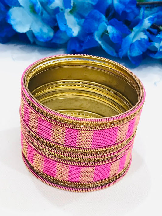Appealing Twisted Spiral Designed Pink Color Metal Bangle Set For Women