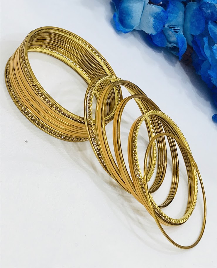 Stone worked Metal bangles in Globe