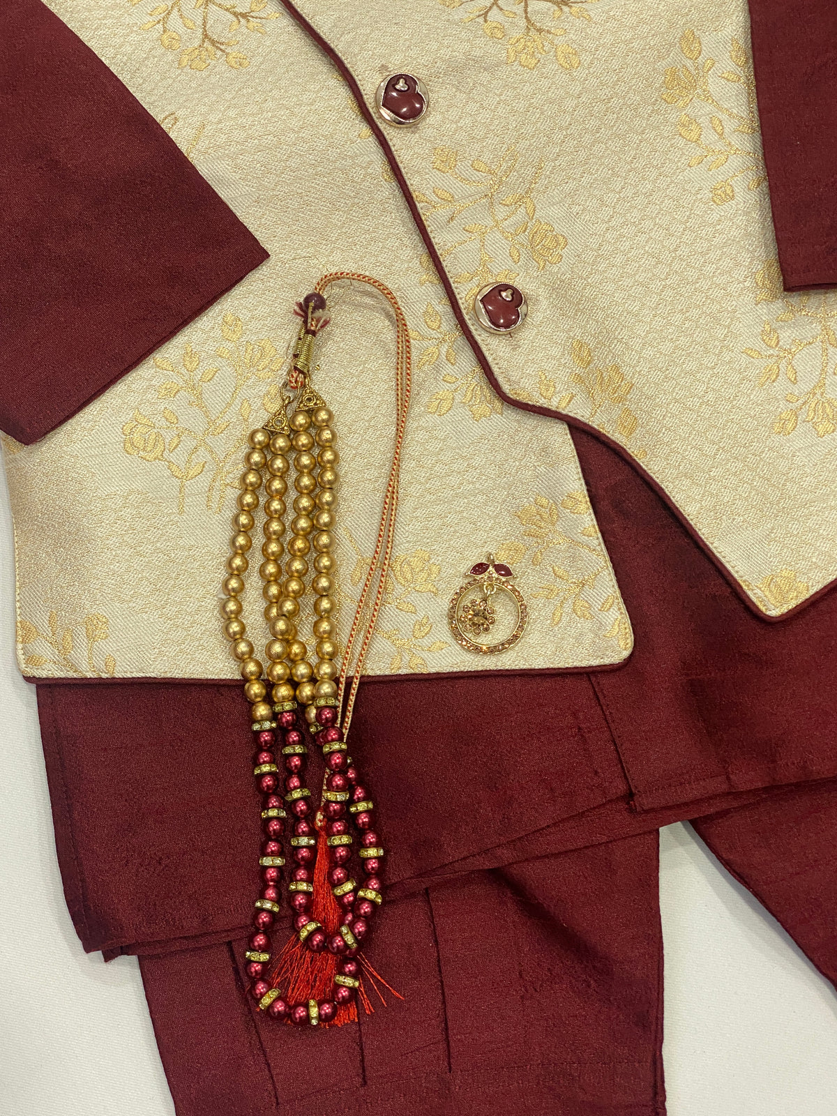 Festive Maroon Color Kids Kurta Set In Silk With Brooch Pin And Pearl Mala