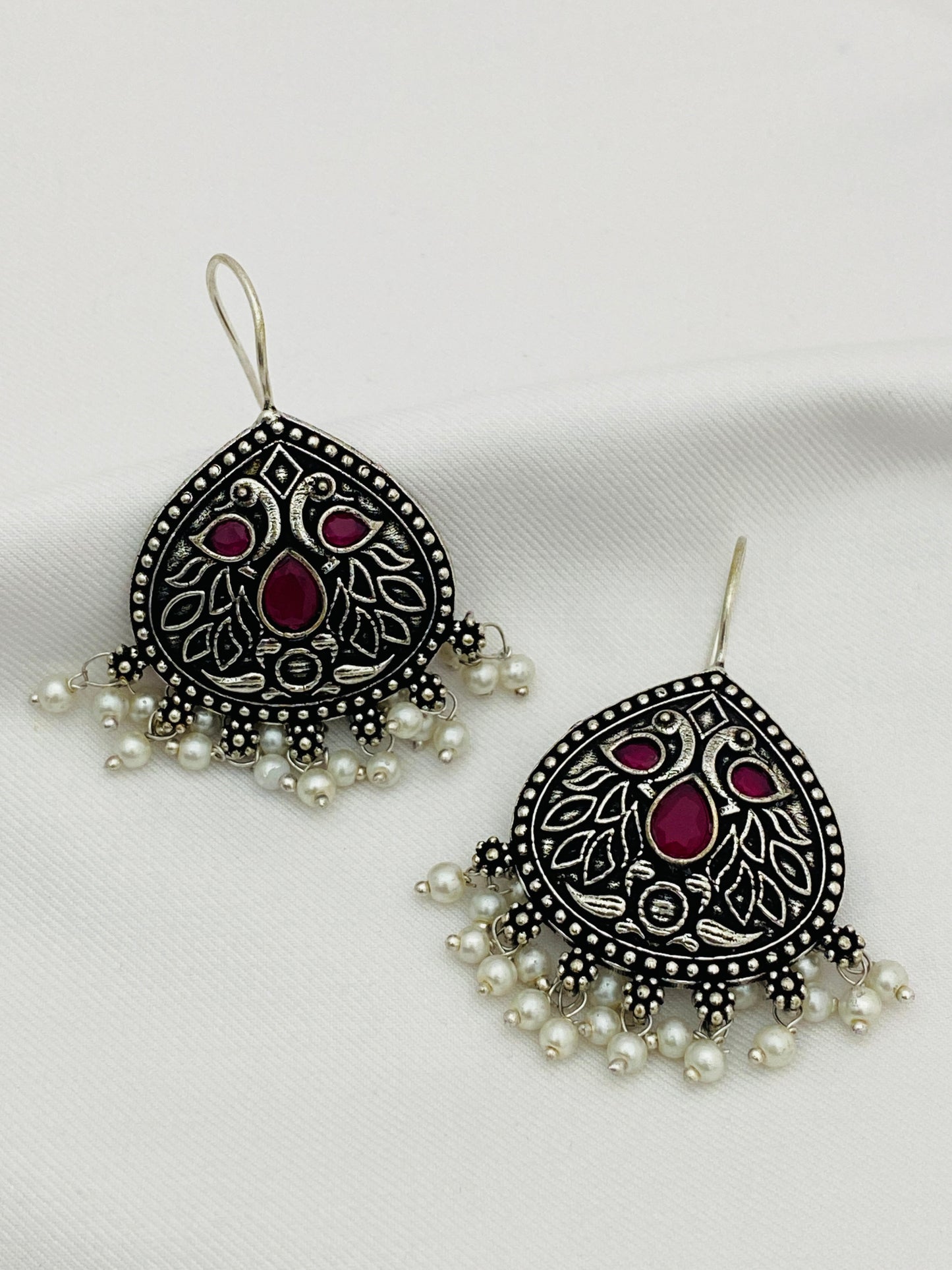 Magnificent Peacock Designed Oxidized Dangler Earrings With Ruby Stones