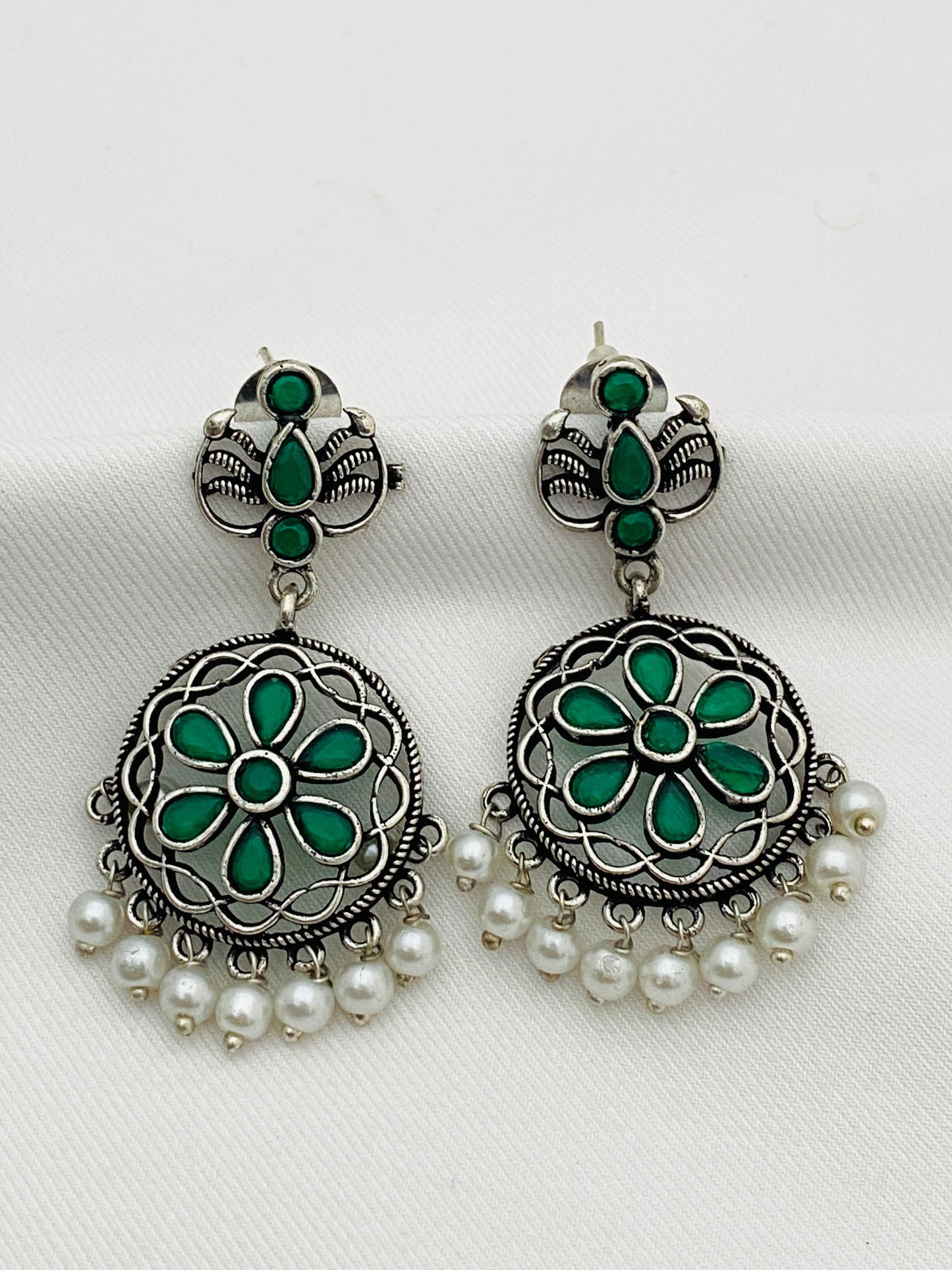 Gorgeous Emerald Stone Studded Flower Designed Silver Toned Oxidized Earrings With Pearl Drops