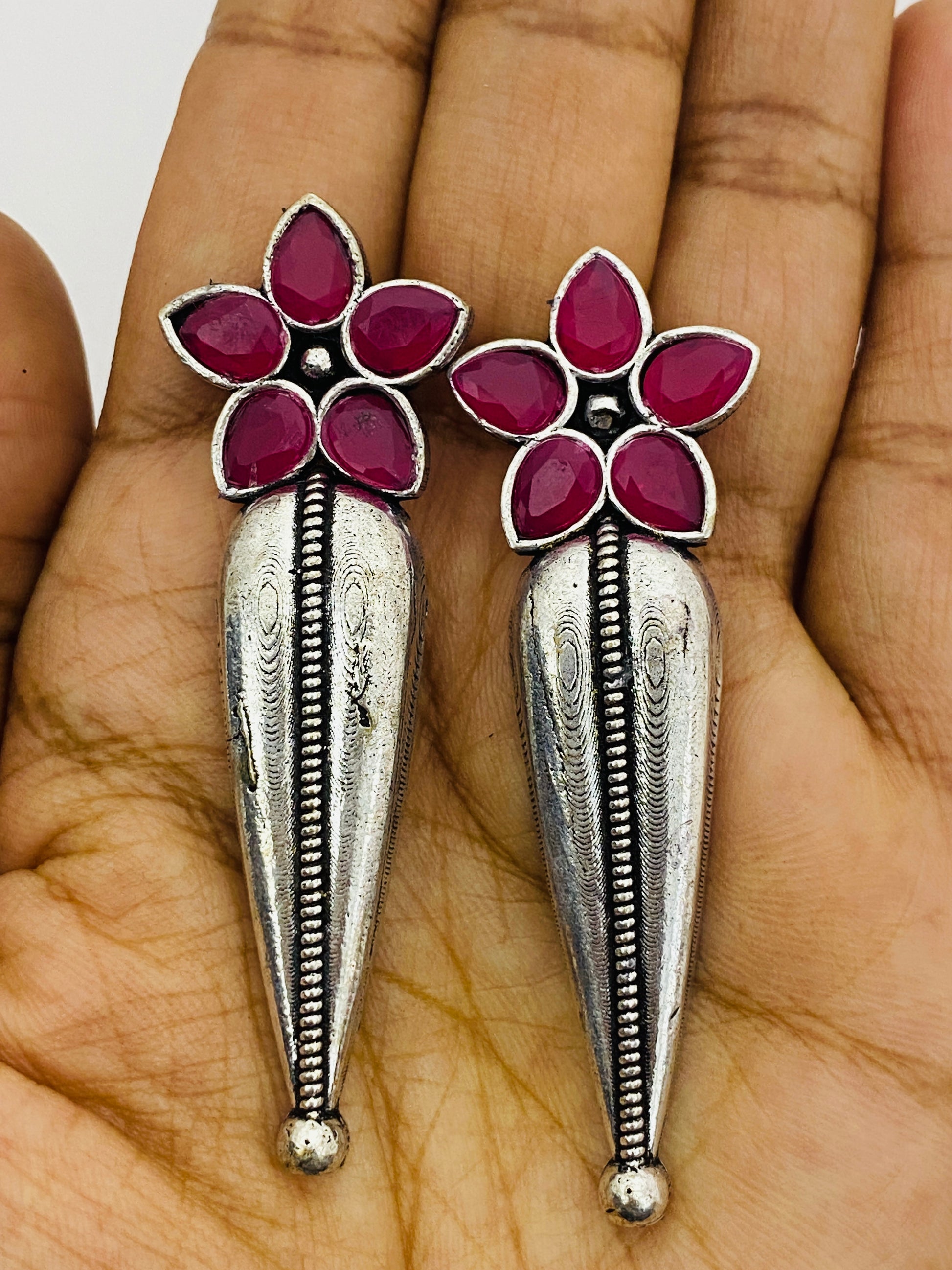 Flower Design Matte Finished Silver Look Alike Dangler Oxidized Earrings With Ruby Art Stone Near Me