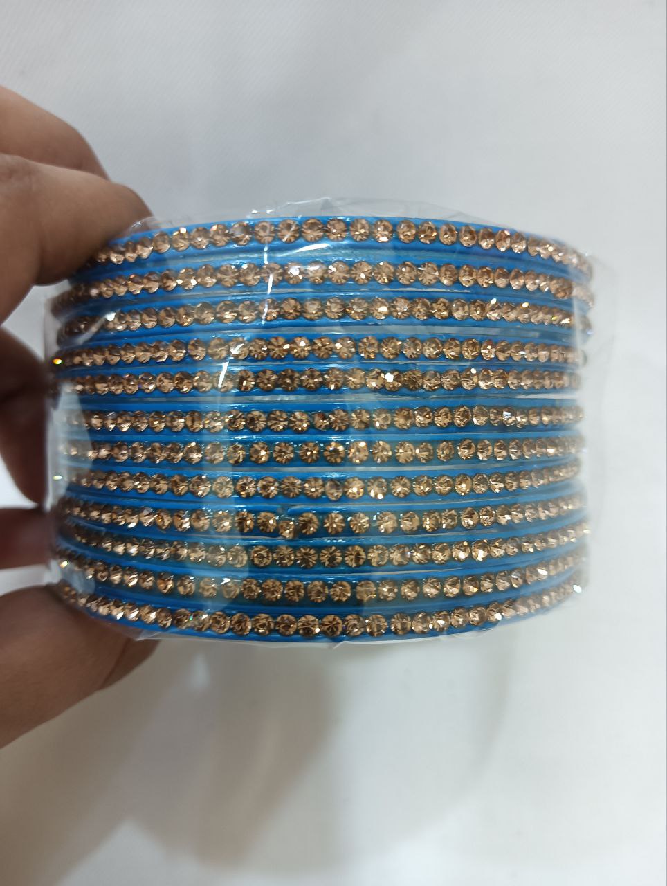 Pleasing Blue Color Glass Bangles With Flashing Gold Stone For
