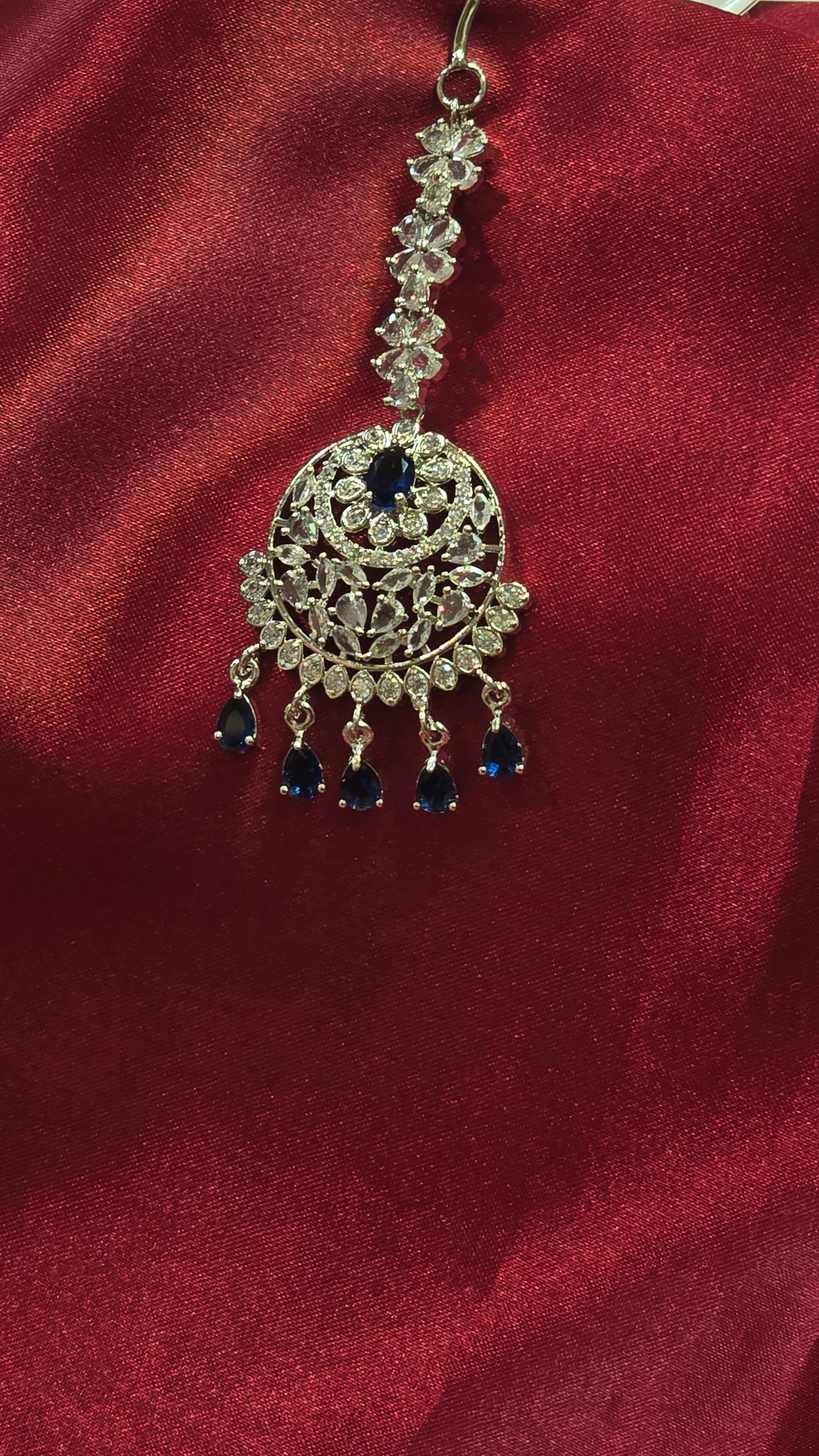 Dazzling Blue Colored American Diamond Tikka With Droplets For Women