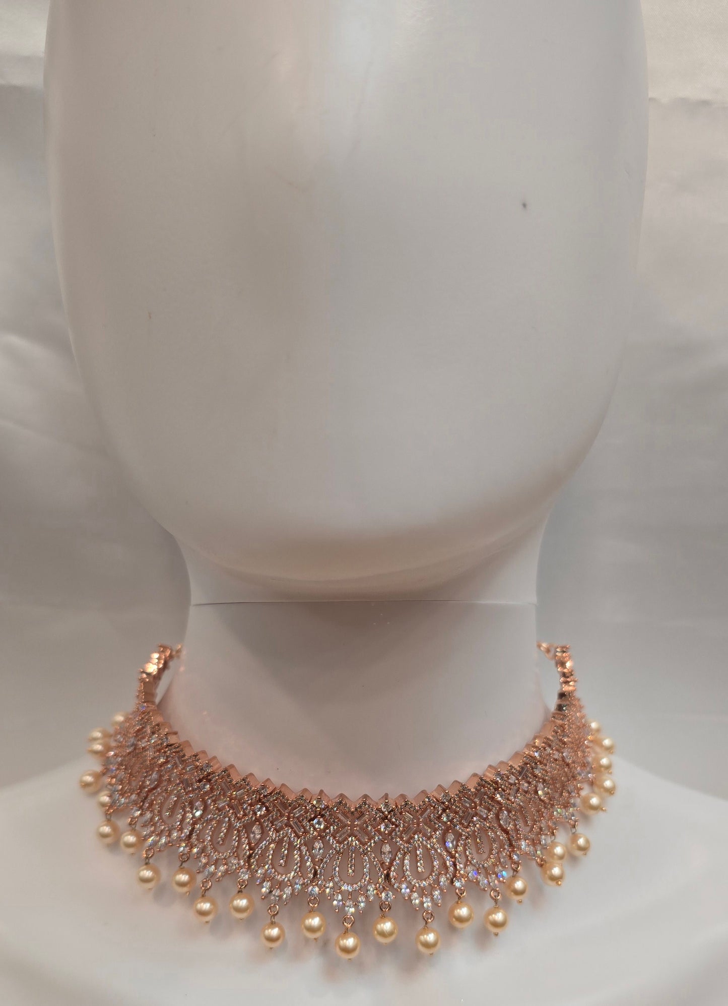 Alluring Rose Gold Plated White Color Stone Worked Necklace With Earrings Set