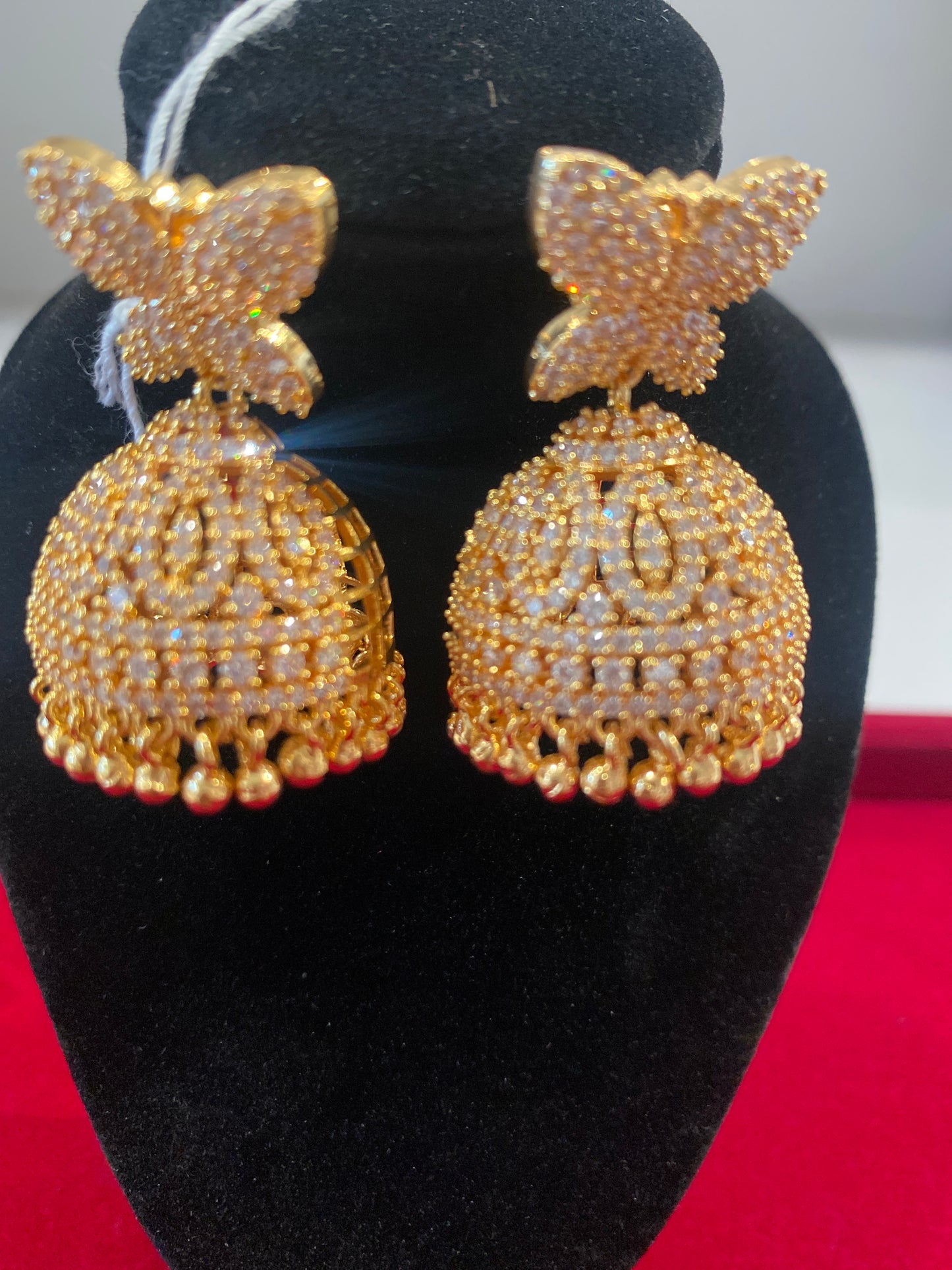 Beautiful White Color Stones Embadded Gold Plated Jhumkas For Women