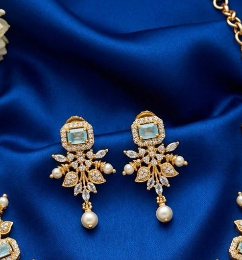 Dazzling Pastel Green Stones Floral Design Gold Plated Necklace With Earrings For Women