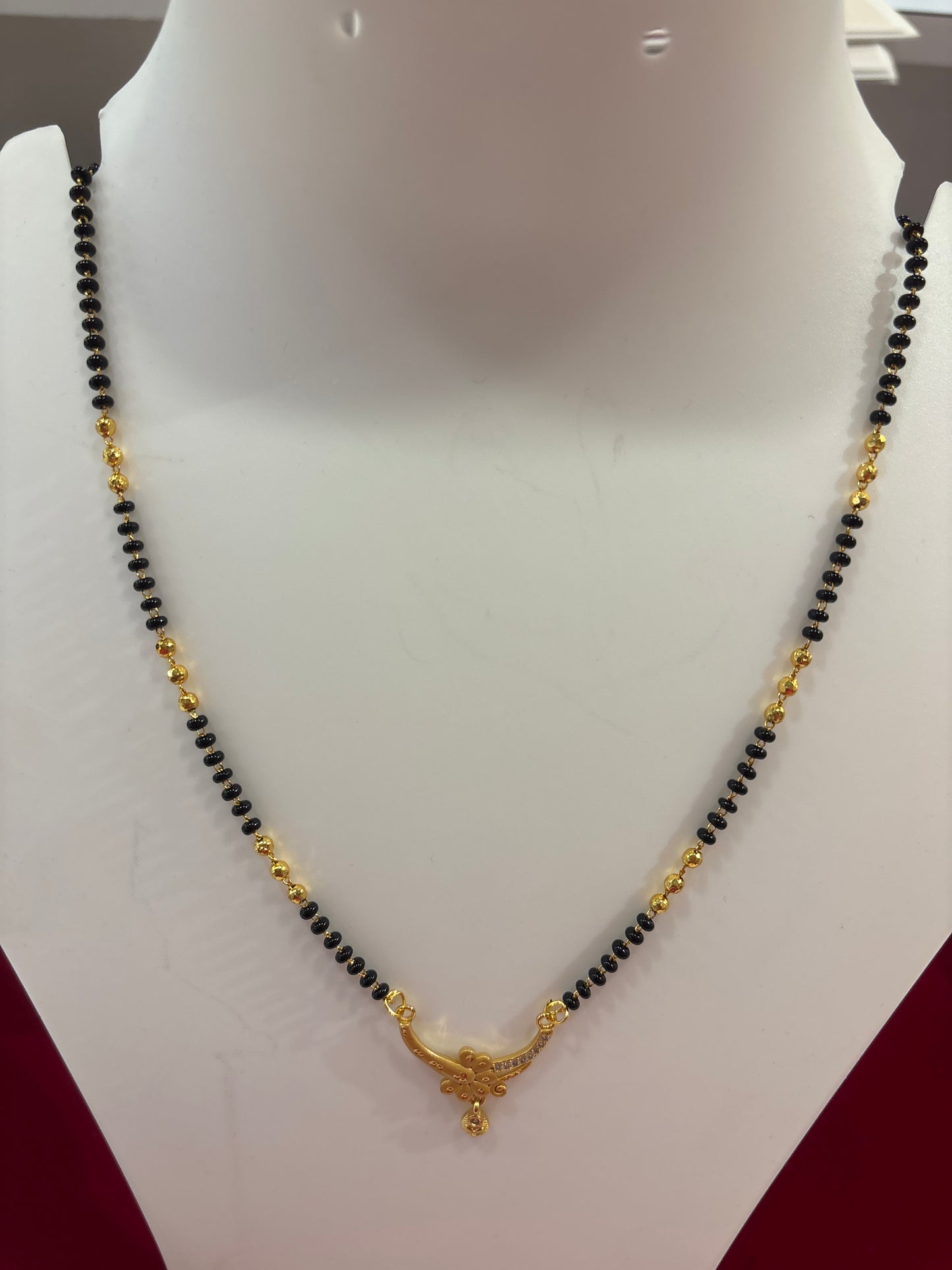 Attractive Black Bead Chain Mangalsutra With Ornate Gold Pendant