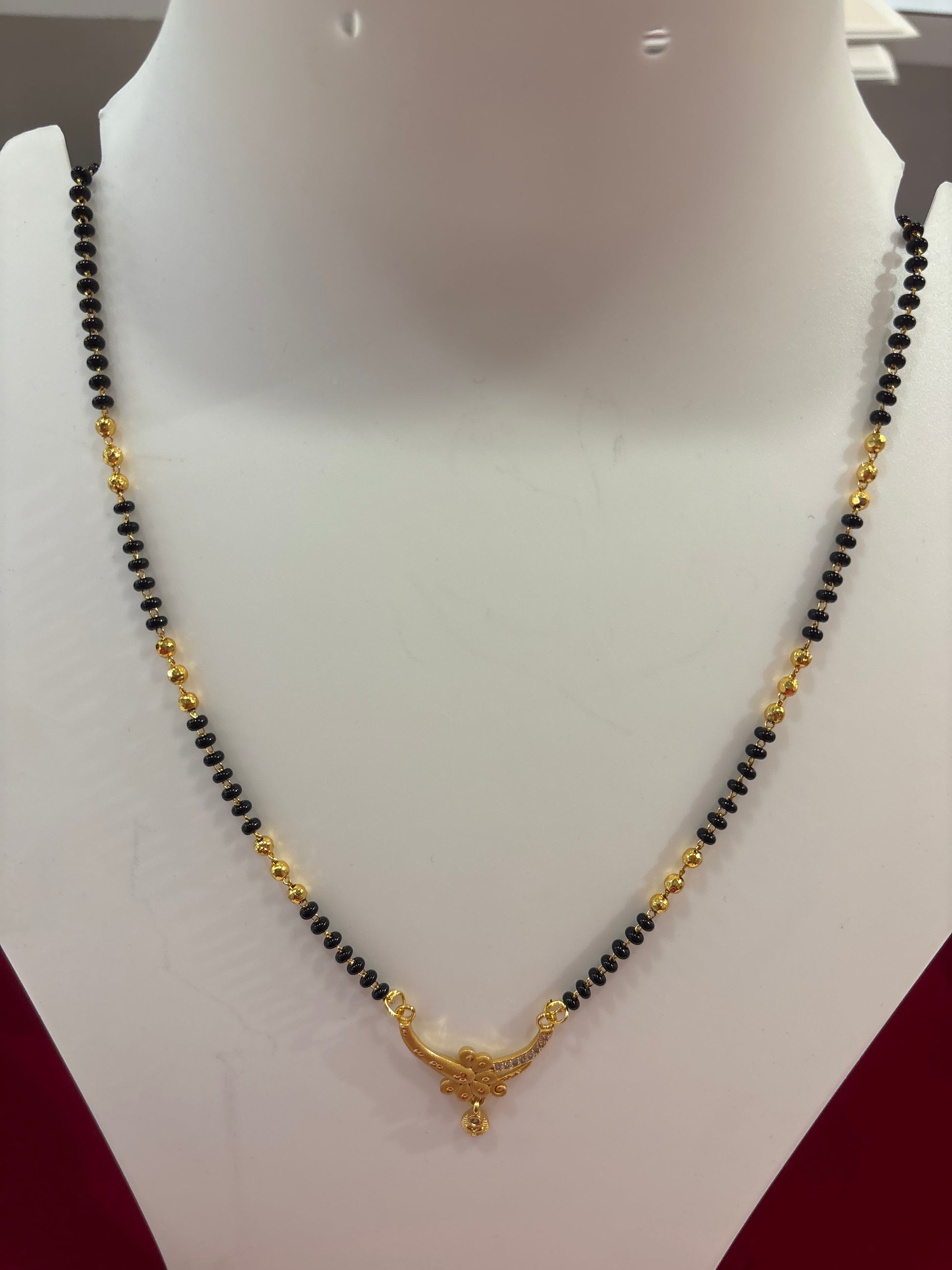 Attractive Black Bead Chain Mangalsutra With Ornate Gold Pendant