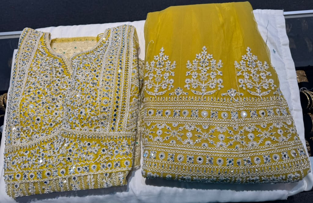 Tremendous Yellow Color Net Fabric Lehengas With Embroidery And Mirror Work For Women