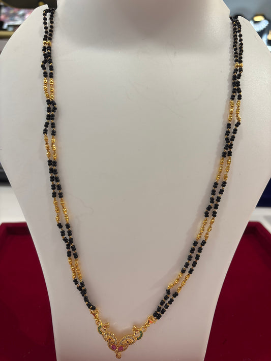 Modern Black Bead Long Chain  Mangalsutra With Ornate Gold Pendant