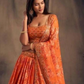 Elegant Orange Color Rose Printed Design and Golden Zari and Sequins Embroidered Lehenga Near Me