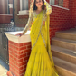 Attractive Yellow Color Faux Georgette Sequins And Thread Work Lehenga Saree For Women
