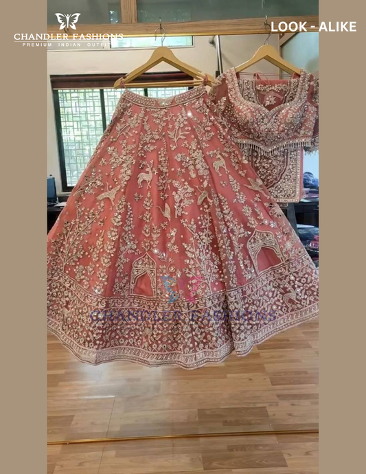 Charming Pink Color Soft Net With Heavy Embroidery And Mirror Work Lehenga For Women