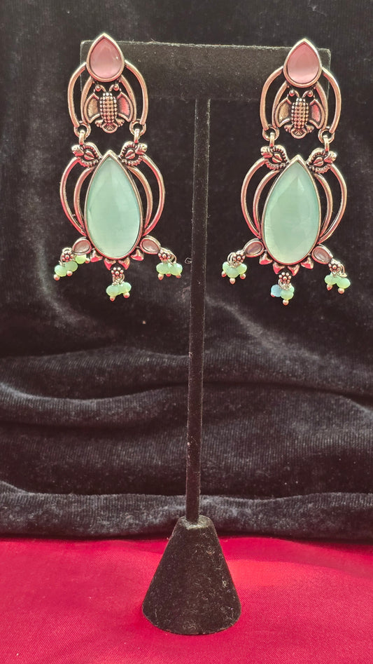 Ravishing Rocket Shaped Pink And Green Earrings