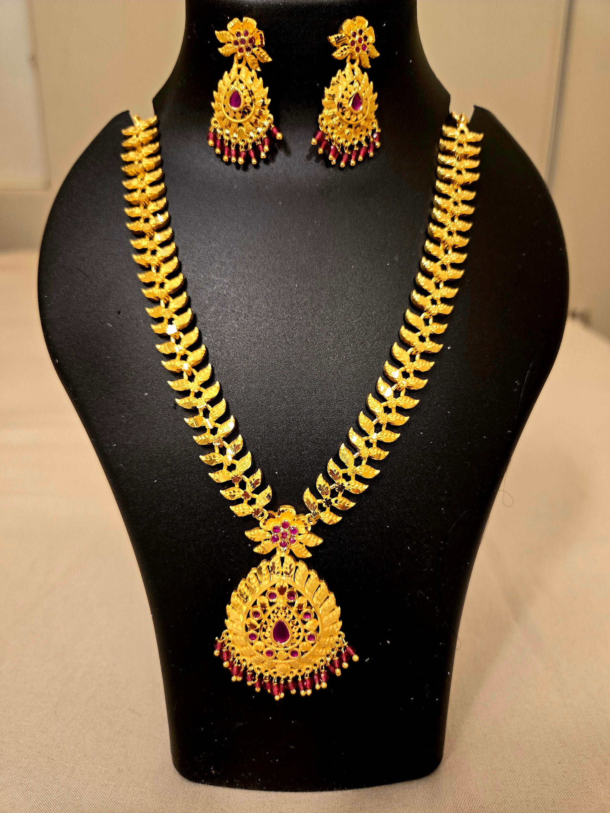 Traditional Gold Plated Dark Pink Stone Studded Necklace With Earrings