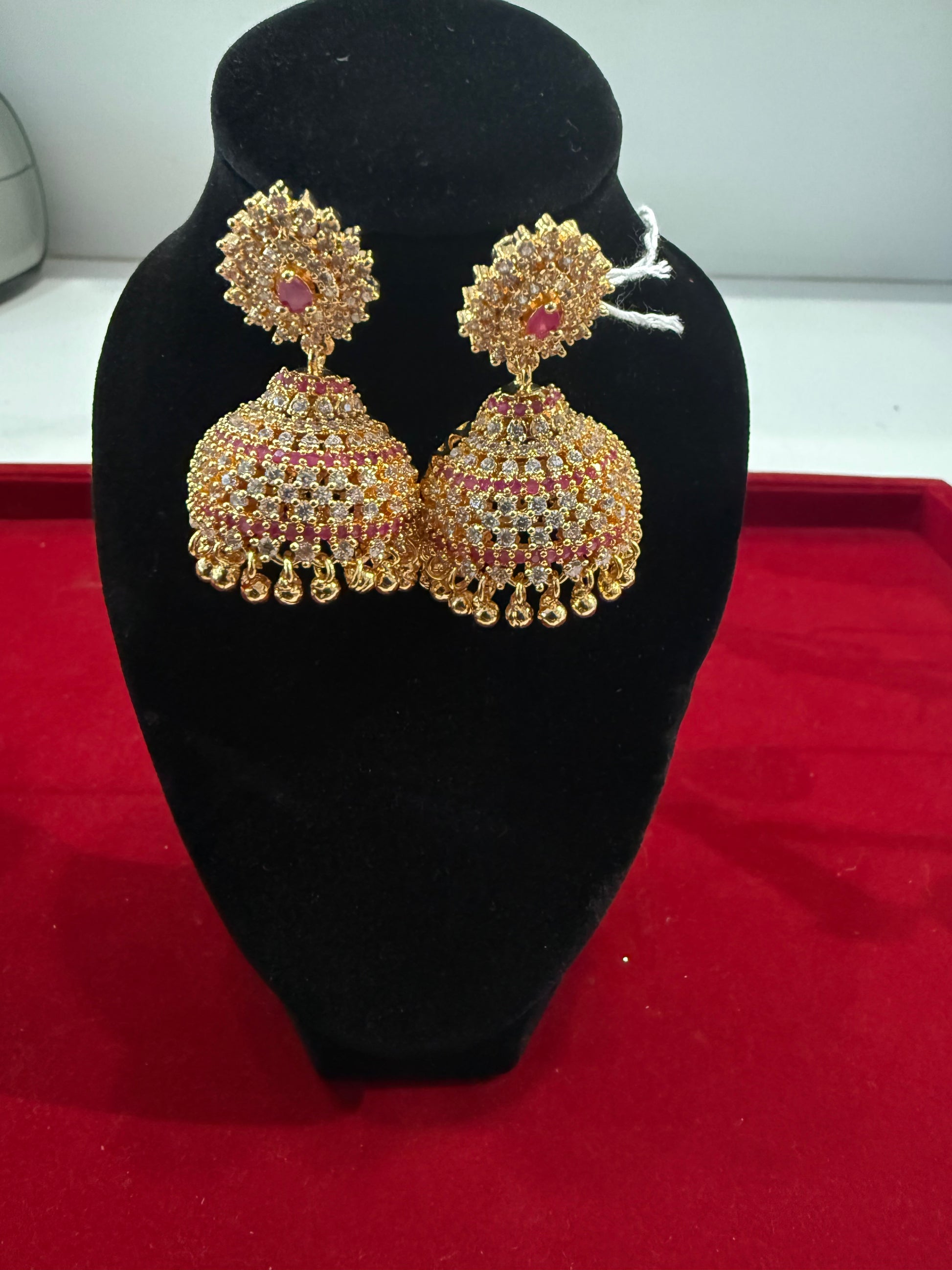 Alluring Pink And White Color Stones With Gold Plated Jhumkas For Women