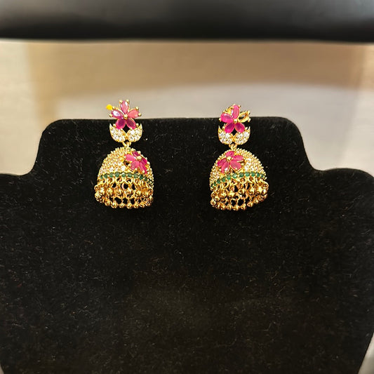 Pleasing Gold Plated Jumka Earrings With Multi Color Stones