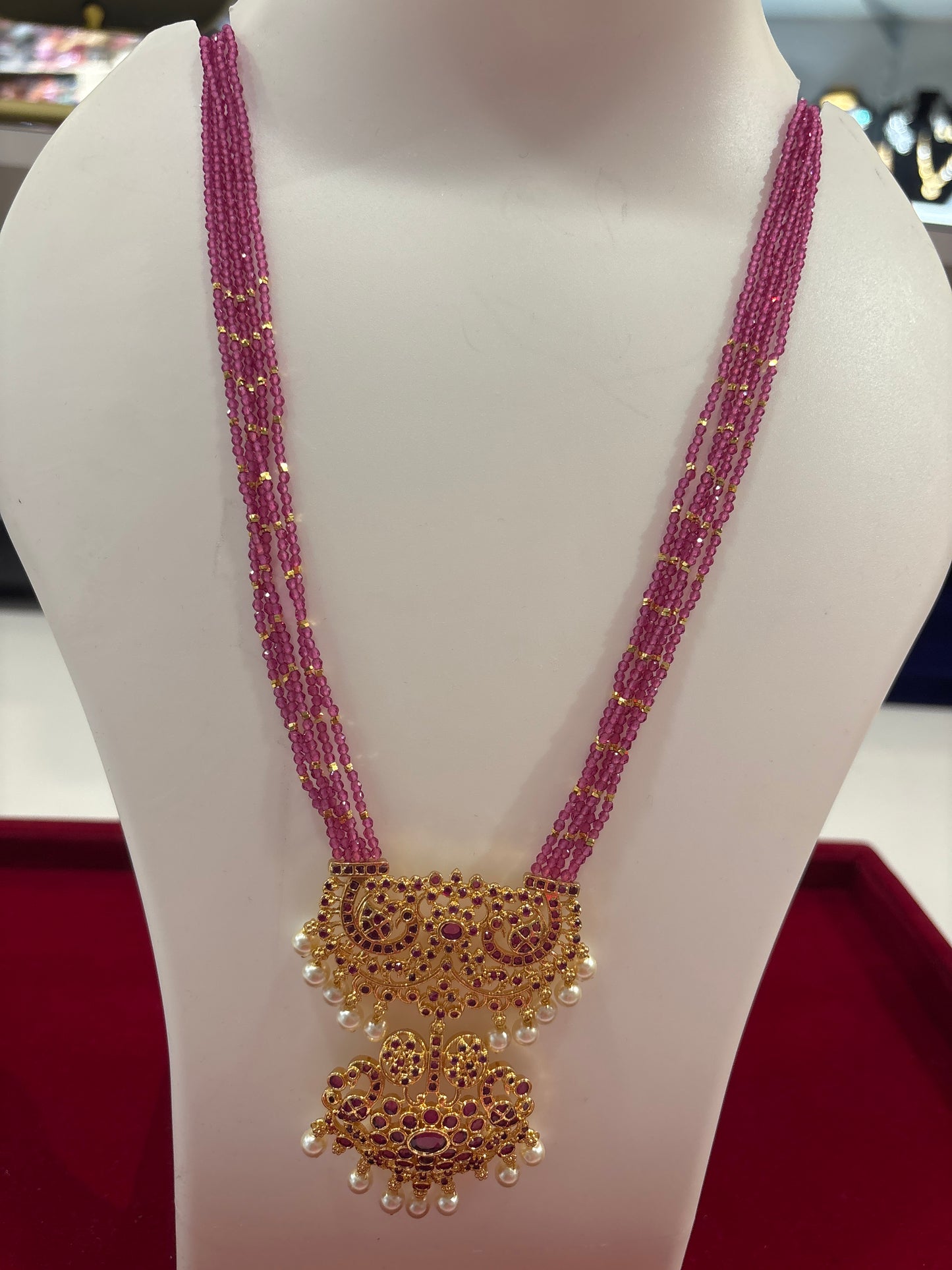Attractive Multi Strand Pink Beads Necklace with Gold Pendant