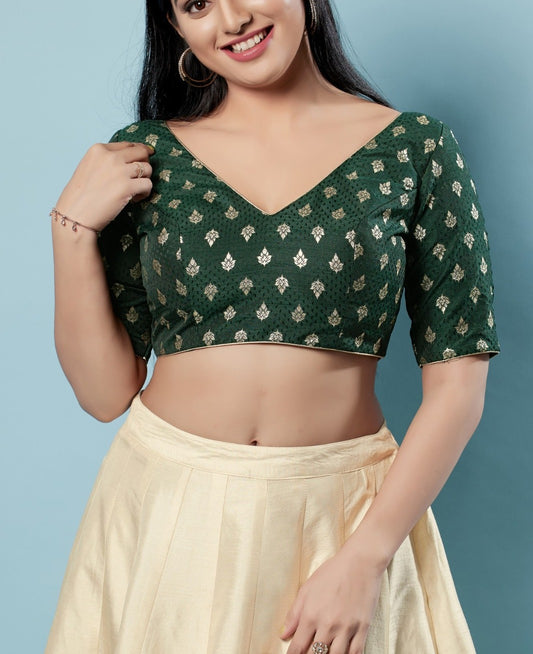 Appealing Green Colored V Neck And Back Open Blouse With Butta Motifs For Women